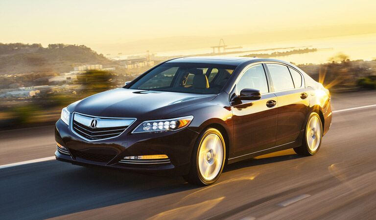 Acura RLX driving away from a sunset outside of the frame of the image