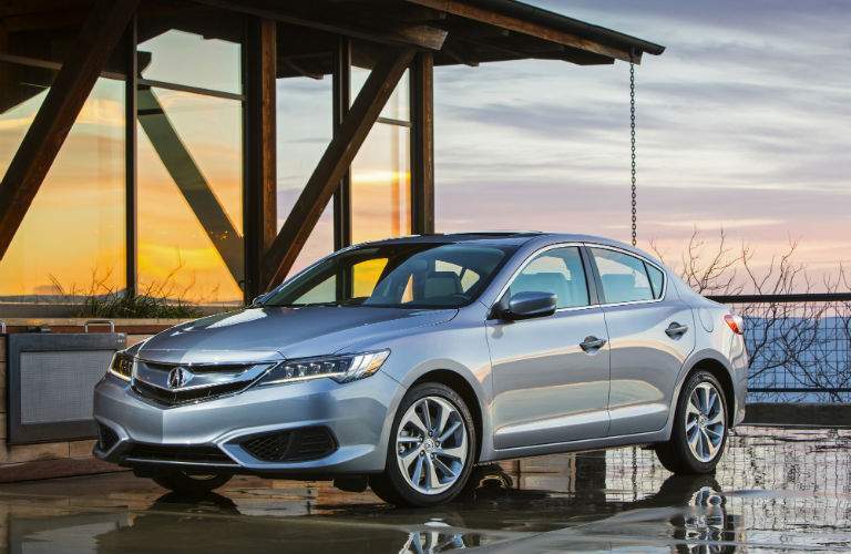 A left right quarter view of the 2018 Acura ILX in front of a home.