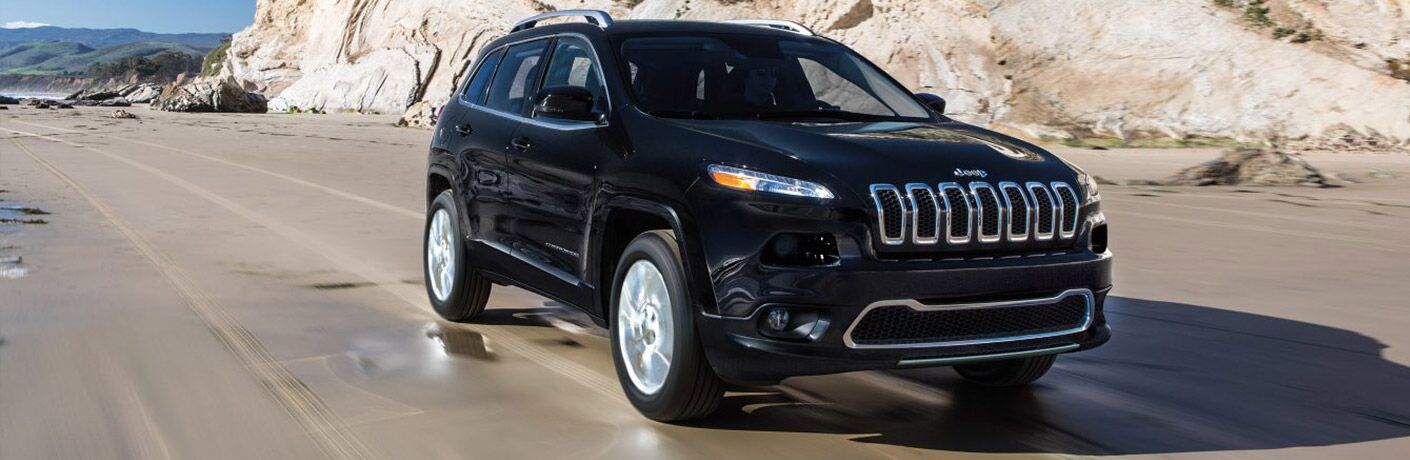 2018 Jeep Cherokee driving down a mountain road