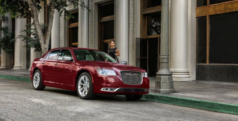 Red 2018 Chrysler 300 parked in front of a bank