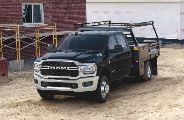 2020 Ram 5500 Chassis Cab black parked outside home construction site