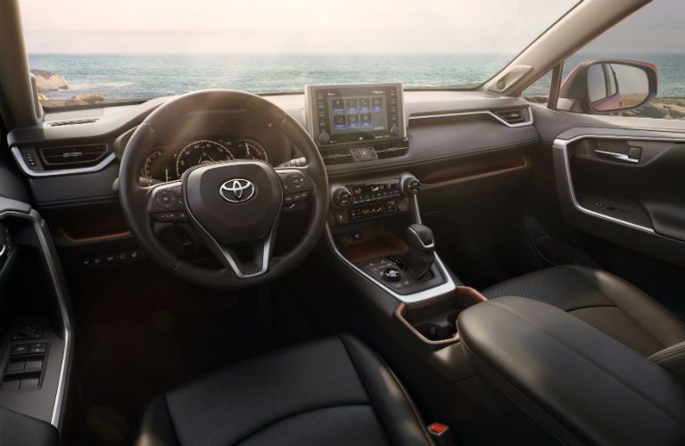 An interior photo of the front of the 2019 RAV4 showing many of its new technology features.