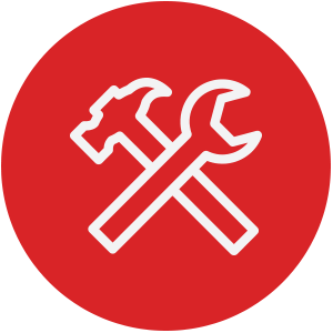 A red circle icon with a white outline of a wrench and hammer crossed.