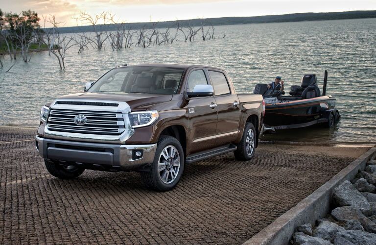 A photo of the 2019 Tundra pulling a boat out of the water.