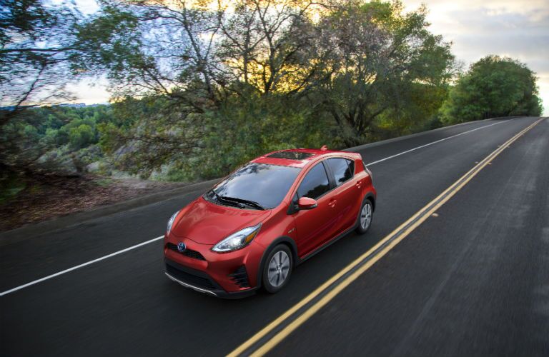 An overhead photo of the 2018 Toyota Prius c in motion on the road.
