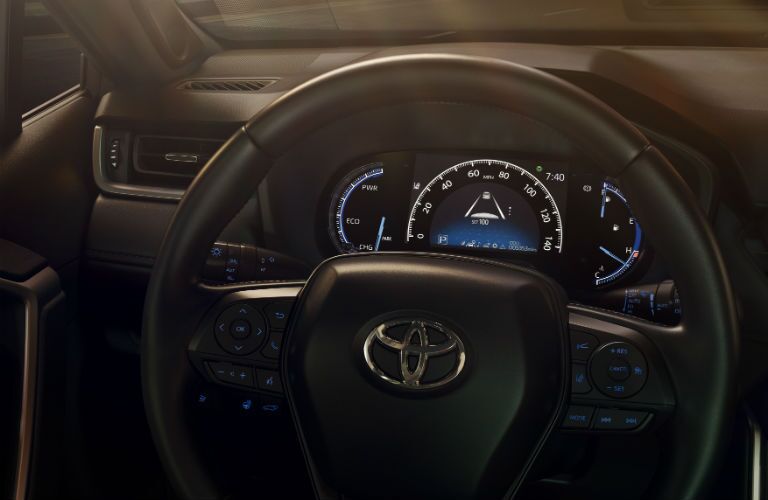 A view of the new dashboard and steering wheel in the 2019 RAV4.