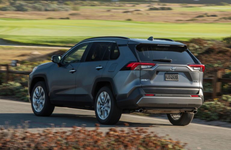 A rear left quarter photo of the 2019 Toyota RAV4 on the road.