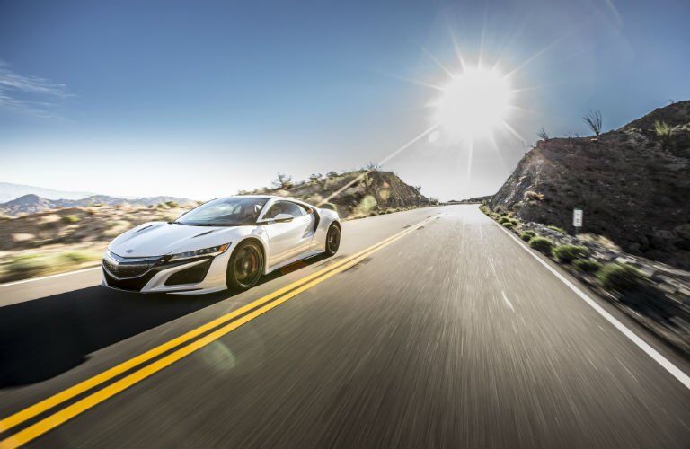 2017 Acura NSX with a solar flare in the background