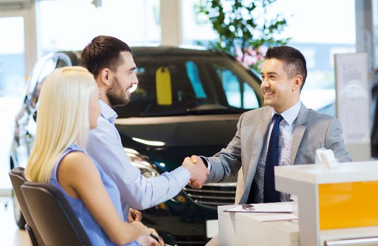 Couple talking to sales associate