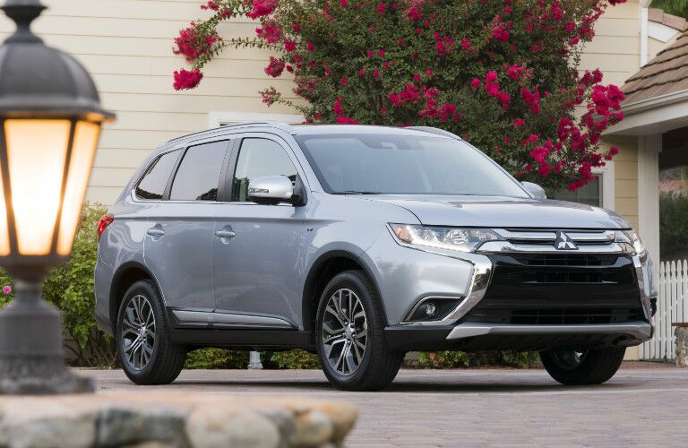 2017 Mitsubishi Outlander exterior front in front of a house