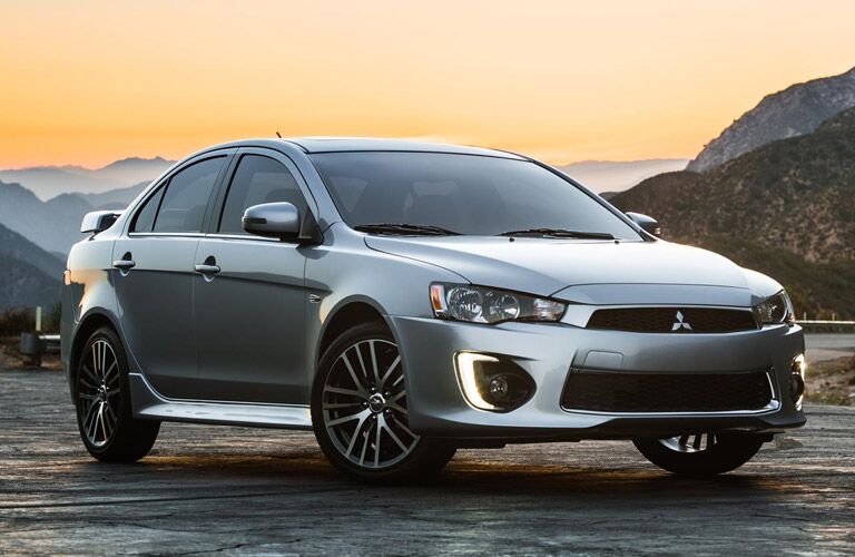 silver 2016 Mitsubishi Lancer at sunset
