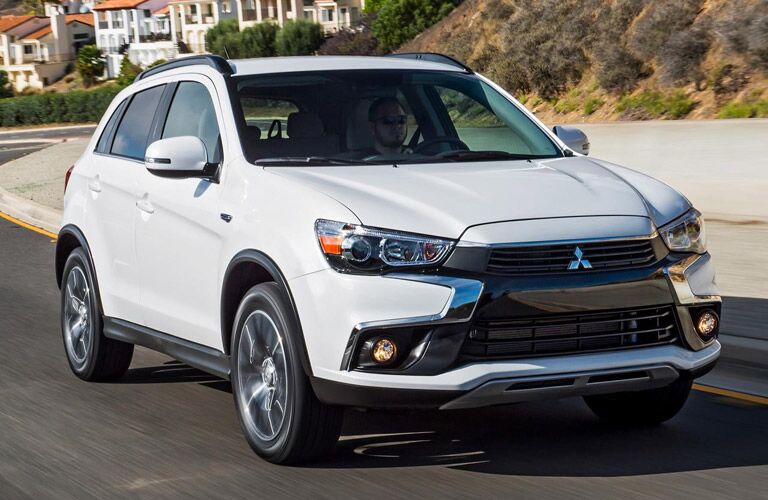 white 2016 Mitsubishi Outlander Sport cruising