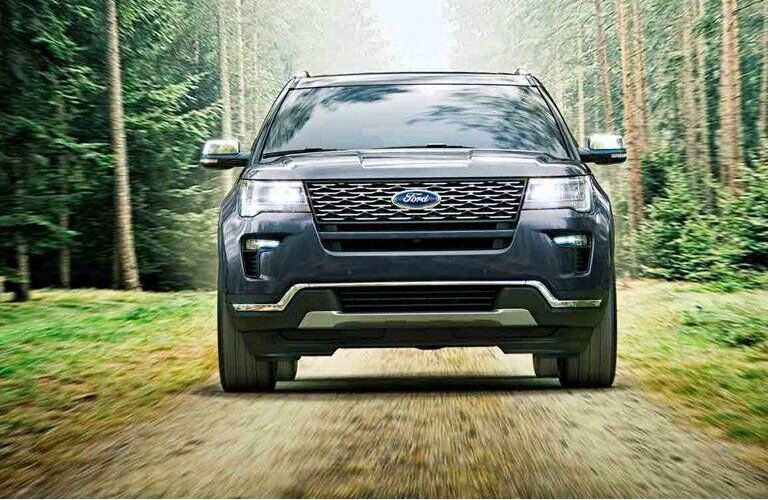 2019 Ford Explorer driving on tree-lined trail