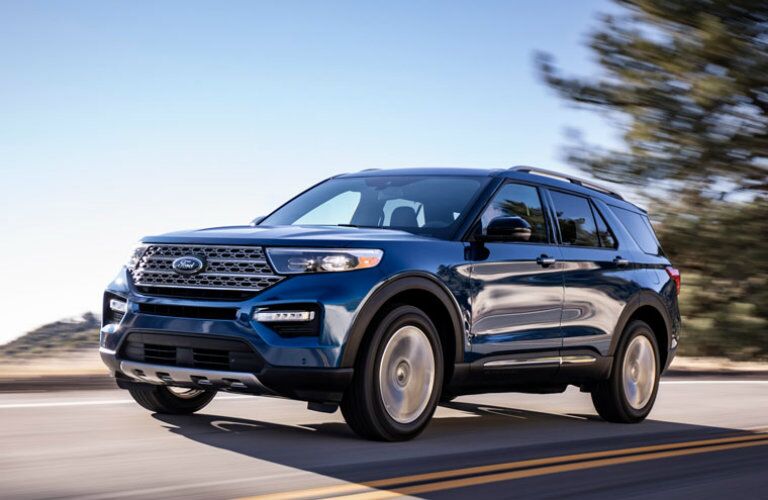 Blue 2020 Ford Explorer driving on country road