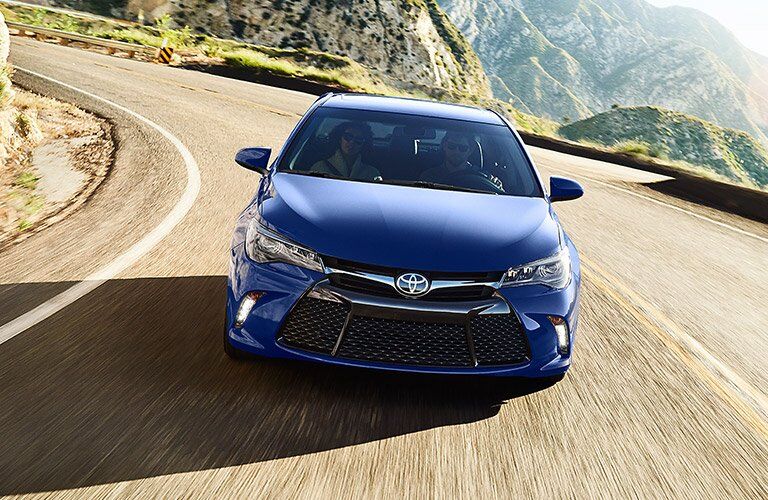 2016 Toyota Camry driving toward you on the road