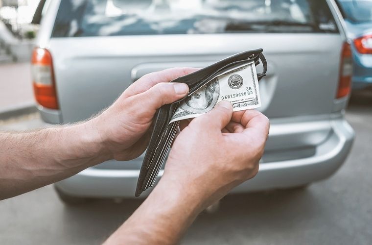Image showing a man taking out money from his wallet
