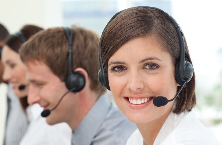 stock photo of customer support people with headsets in a line