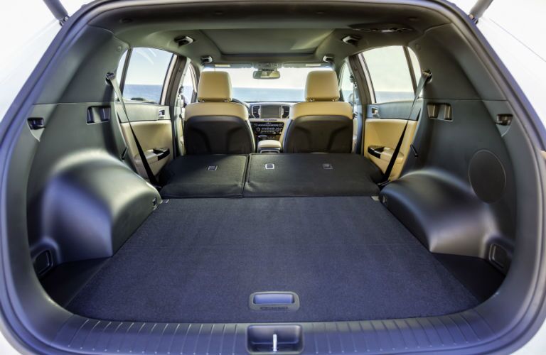 An interior photo showing the maximum cargo space configuration for the 2018 Sportage.