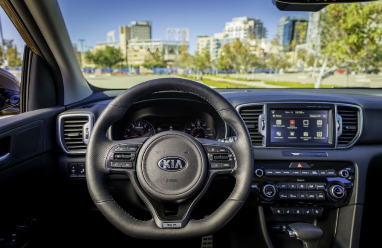 A photo showing the driver's perspective inside of the 2018 Kia Sportage.