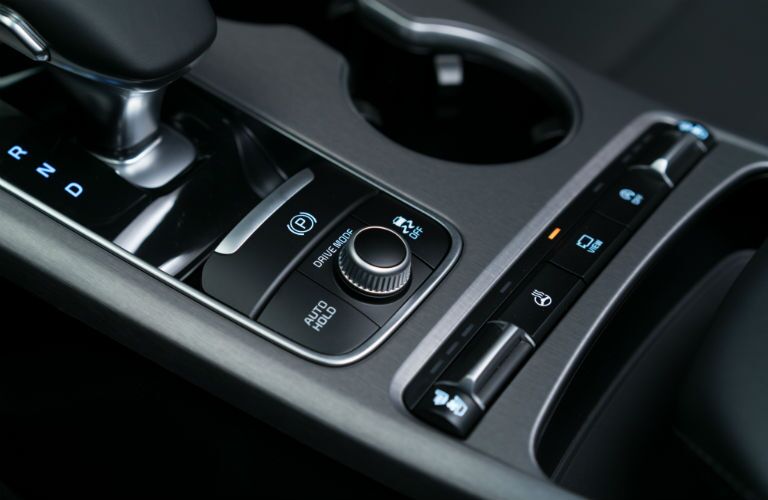 A close up photo of the controls for the selectable driving modes in the 2018 Kia Stinger.
