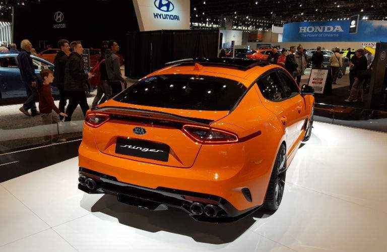 A rear quarter photo of a 2018 Kia Stinger GT on display at the Chicago Auto Show