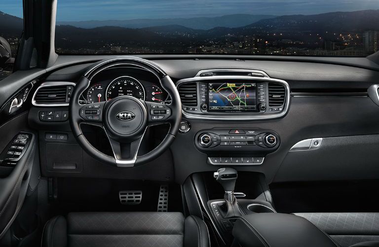 A photo showing the dashboard of the 2018 Sorento including the center stack and infotainment system's touchscreen.