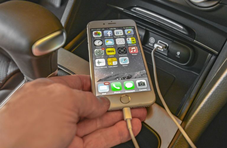 Another close up photo of a smartphone plugged into the 2018 Optima.