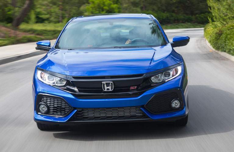 2017 Honda Civic Si driving down the road