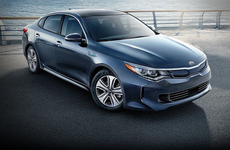 blue 2018 kia optima hybrid parked on dock