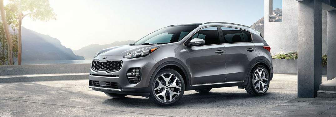 silver 2018 kia sportage in front of scenic mountain view