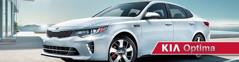 white 2019 Kia Optima with banner