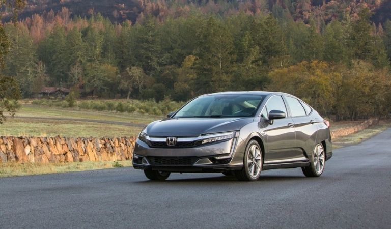 Gray 2020 Honda Clarity Plug-In Hybrid on a Country Highway