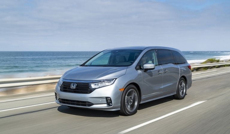 Silver 2021 Honda Odyssey on a Coast Road
