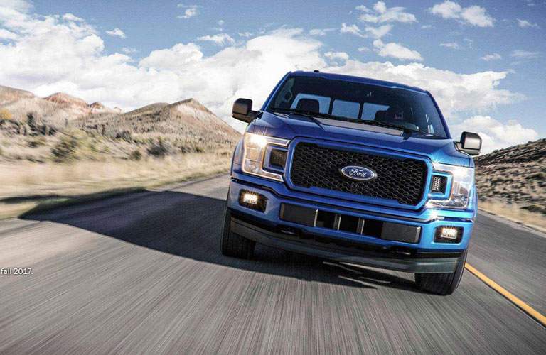 2018 Ford F-150 blue front view on road