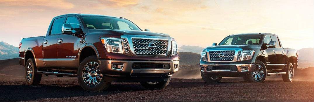 red 2017 nissan titan and titan xd parked in desert