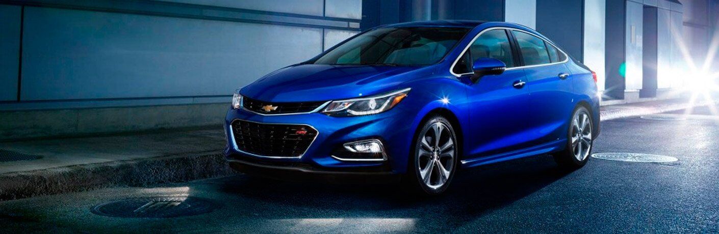 Driver's side extrior view of a blue Chevy Cruze