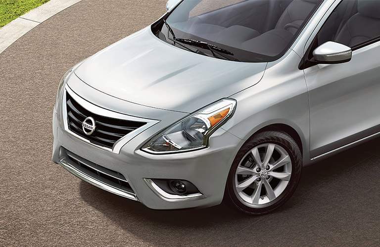 silver nissan versa hood, parked