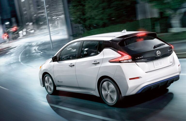 Exterior view of the driver's side of a white 2019 Nissan Leaf