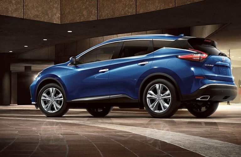 Exterior view of a blue 2019 Nissan Murano parked in a showroom