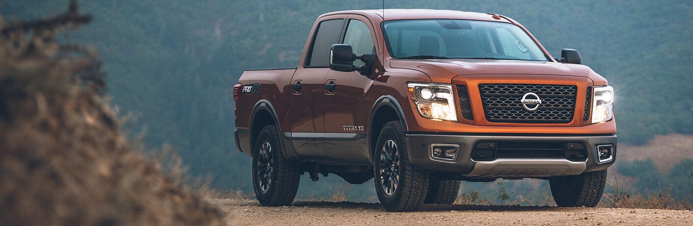 2019 Nissan Titan orange on dirt road