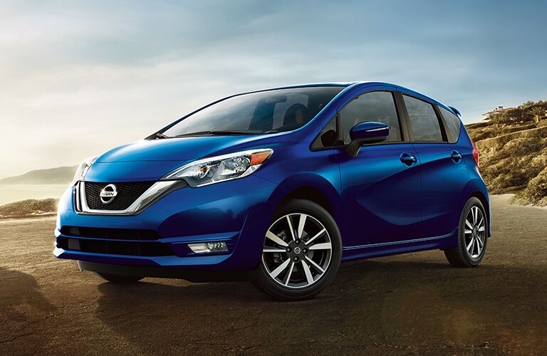 Exterior view of a blue 2019 Nissan Versa Note parked near the beach