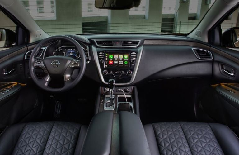 Interior view of the steering wheel and touchscreen inside a 2020 Nissan Murano