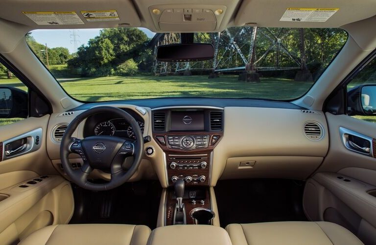 Interior view of a steering wheel and a touchscreen display inside a 2020 Nissan Pathfinder
