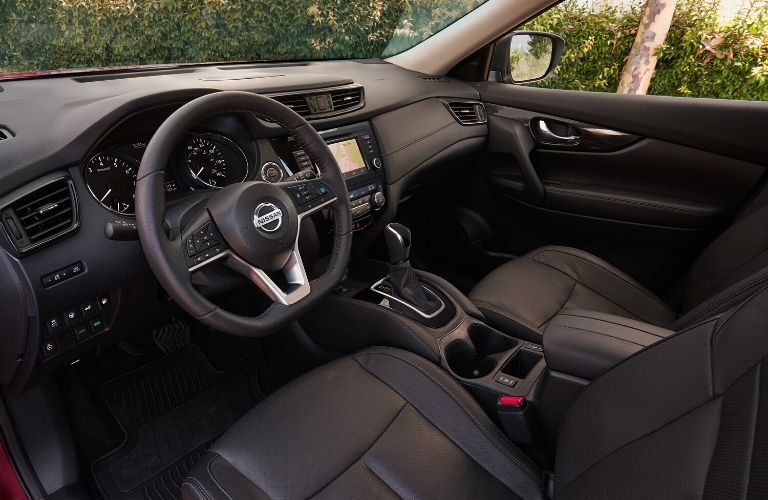 Interior view of the front seating area inside a 2020 Nissan Rogue