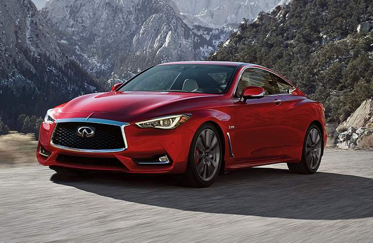 red infiniti q60 by mountains