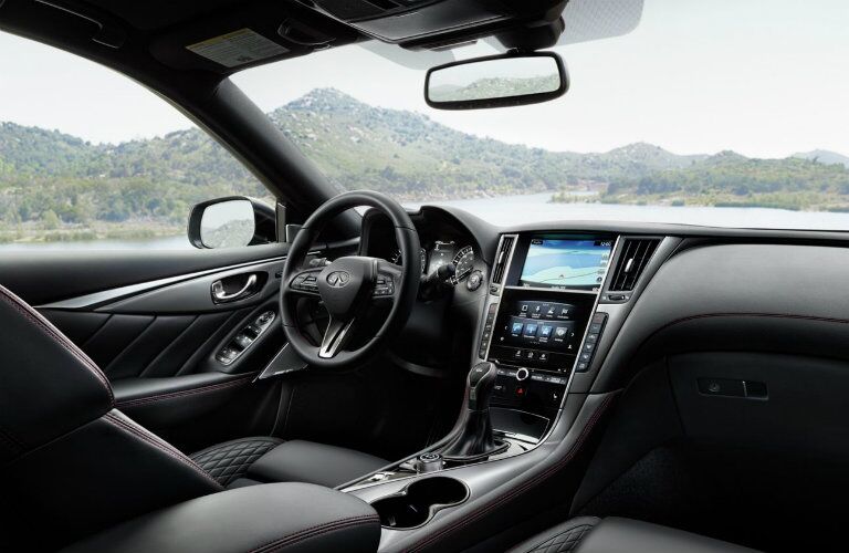 Interior view of the front seating area inside a 2019 INFINITI Q50