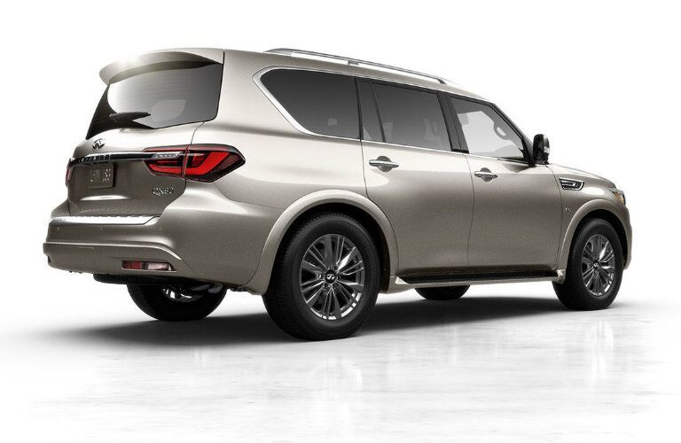 Exterior view of the rear of a beige 2019 INFINITI QX80