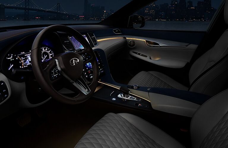 Interior view of the black seating and black steering wheel inside a 2019 INFINITI QX50