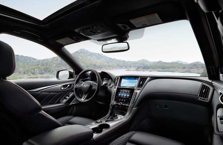 Interior view of the front seating area inside a 2020 INFINITI Q50