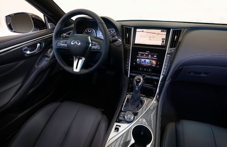Interior view of the front seating area inside a 2020 INFINITI Q60